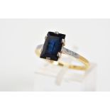 A SAPPHIRE RING, with a central rectangular cut sapphire within a six-claw setting, to the plain