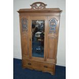 A MID CENTURY WALNUT SINGLE MIRRORED DOOR WARDROBE with a long single drawer to base (sd, losses)