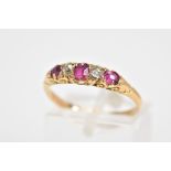 AN EARLY 20TH CENTURY RUBY AND DIAMOND BOAT RING, designed with a row of graduated oval cut rubies