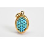 A VICTORIAN TURQUOISE PENDANT, of oval design set with a small round cabochon turquoise centre, with