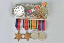 A SMALL TIN OF FOUR MEDALS, to include 1939-45 Star, Burma Star, Defence medal and War medal, also