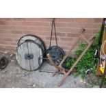 A VINTAGE CAST IRON 'IRONCRETE' GARDEN ROLLER FRAME, length 84cm, two steel ringed wooden wheels