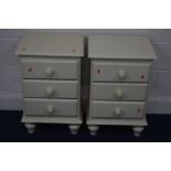 A PAIR OF CREAM PAINTED THREE DRAWER BEDSIDE CABINETS