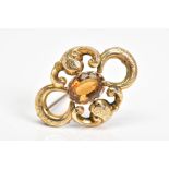 A VICTORIAN GOLD BROOCH, designed with a central oval cut citrine within a fourteen claw setting and