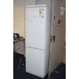 A SWAN TALL FRIDGE FREEZER height 184cm x width 60cm and a Panasonic microwave (both PAT pass and