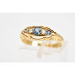 AN EARLY 20TH CENTURY FIVE STONE RING, set with three circular cut sapphires interspaced by one