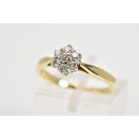 A 9CT GOLD DIAMOND RING, designed as a cluster of round brilliant cut diamonds, to the tapered