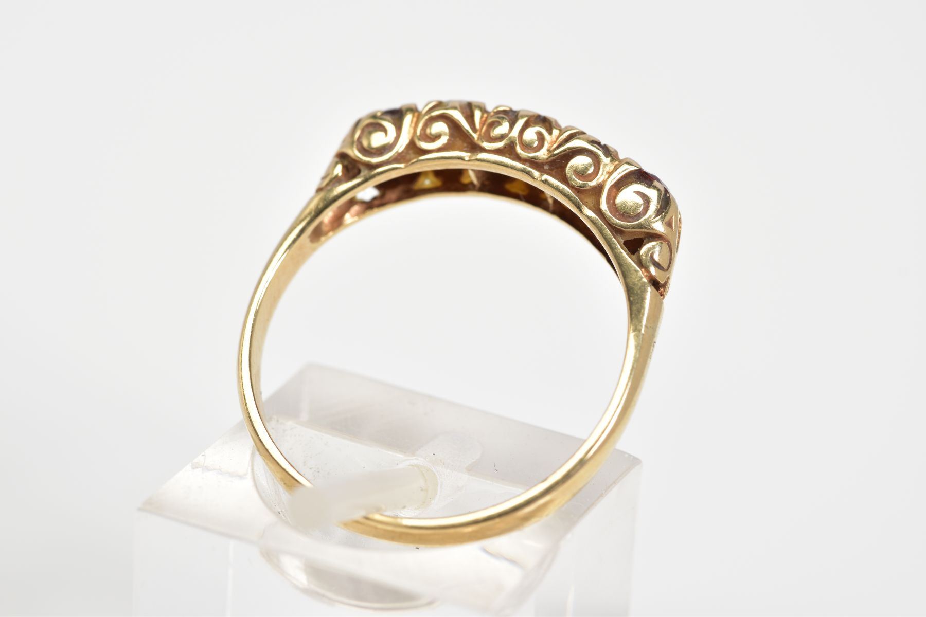 A 9CT GOLD RING, designed as a row of three circular cut garnets interspaced by two circular opals - Image 3 of 3