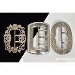 THREE SILVER BELT BUCKLES, the first of oval shape with floral engraved detail, Birmingham hallmark,