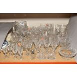 A GROUP OF CUT GLASS, including vases, tankard, dessert dishes, serving dish, liqueur glasses,