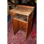 A LATE 19TH CENTURY OAK LECTURN, raised back, sloped top, tongue and groove panelled sides, single