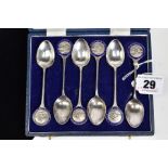 A SET OF SIX SILVER TEASPOONS, each with a round blue enamel medal depicting a rifle men, to each