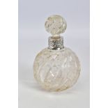 A LATE VICTORIAN SILVER MOUNTED CLEAR GLASS SCENT BOTTLE, with moulded swirl and hobnail cut