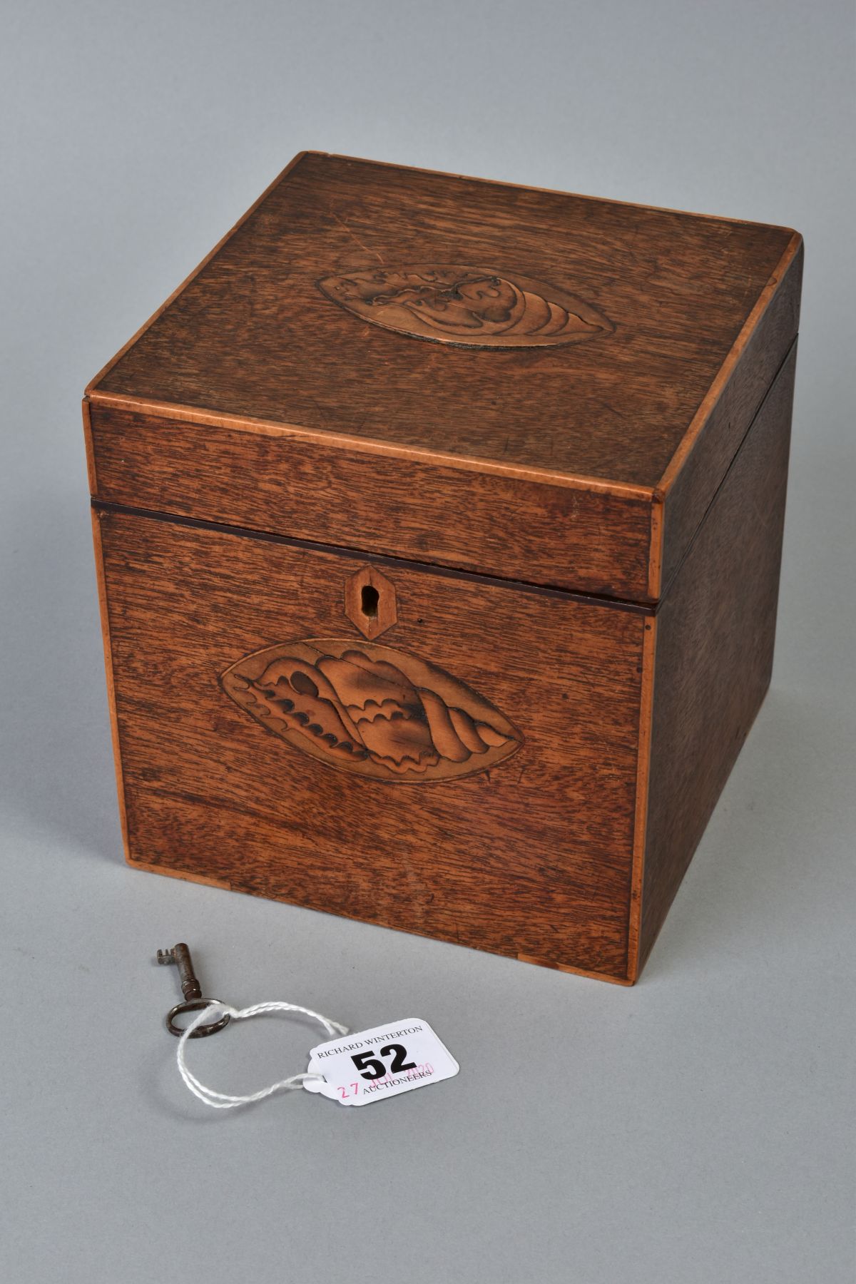 A GEORGE III MAHOGANY AND SATINWOOD INLAID TEA CADDY OF CUBE FORM, circa 1785, the hinged lid and