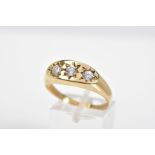 A 9CT GOLD THREE STONE GYPSY RING, set with three round cut cubic zirconia stones, to a plain