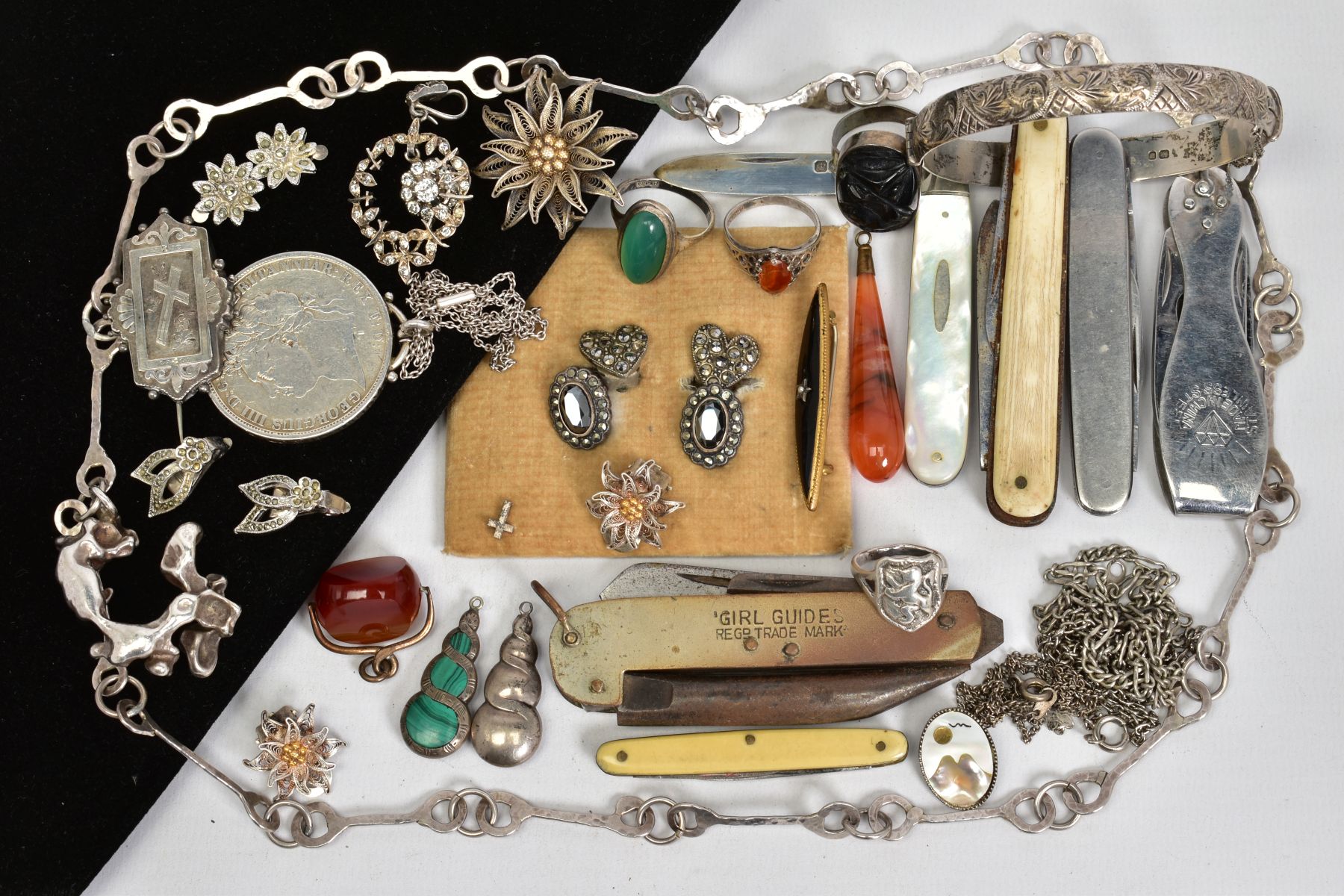 A SELECTION OF ITEMS, to include a silver engraved bangle with safety clasp, various non pierced