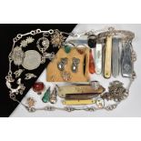 A SELECTION OF ITEMS, to include a silver engraved bangle with safety clasp, various non pierced