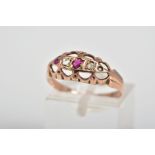 A 9CT GOLD FIVE STONE RING, designed with circular cut rubies interspaced by one single cut and