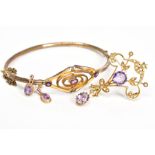 AN AMETHYST COLLECTION OF JEWELLERY to include an early 20th Century amethyst gold plated oval