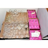 TWO BOXES OF GLASSWARE, including cut glass wine glasses, sherry glasses, wheel etched water jug
