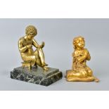 A 19TH CENTURY GILT BRONZE FIGURE OF A CLASSICAL BOY, seated on a stool with crossed ankles, on a