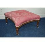 A REPRODUCTION OAK EDWARDIAN STYLE SQUARE CONCAVE FOOTSTOOL, with pine floral upholstery on fluted