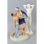 A ROYAL DUX FIGURE GROUP OF TWO EXOTIC DANCERS, on a circular base, the underside with painted '