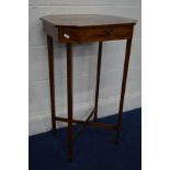 AN EDWARDIAN MAHOGANY AND SATINWOOD BANDED RECTANGULAR WORK SEWING TABLE with canted corners, the