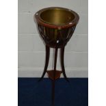 AN EDWARDIAN MAHOGANY, SATINWOOD BANDED AND STRUNG CIRCULAR JARDINIERE, with a removable brass