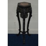 A TALL CHINESE HARDWOOD HEXAGONAL JARDINIERE STAND with a veined marble panel above a carved and