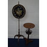 AN EARLY 20TH CENTURY REGENCY STYLE MAHOGANY POLE SCREEN, the floral tapestry on a black ground