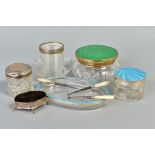 A GROUP OF SILVER MOUNTED DRESSING TABLE JARS, ETC, including a pin cushion of oval form and a glass