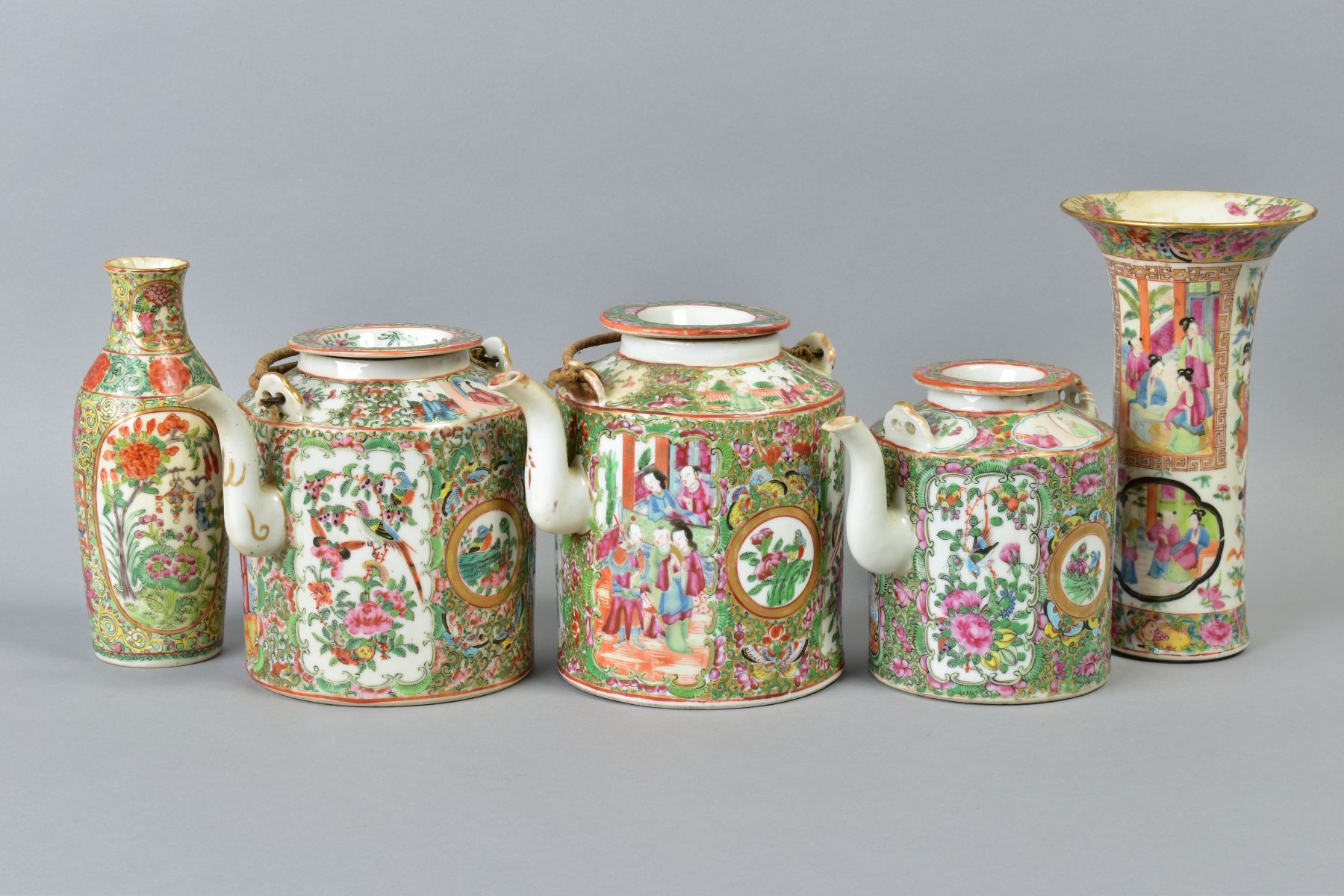 THREE 19TH CENTURY CHINESE CANTON FAMILLE ROSE TEAPOTS AND COVERS, two with wicker handles (s.d.),