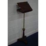 A REGENCY MAHOGANY READING STAND, the adjustable top with gilt tooled burgundy inlay, cylindrical