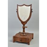 A GEORGIAN MAHOGANY SHIELD SHAPED TOILET MIRROR, between an urn support with a height and rotating