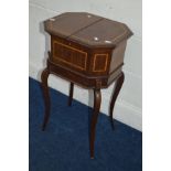 AN EDWARDIAN MAHOGANY AND STRUNG SEWING BOX, rectangular form with canted corners, double fold