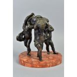 A LATE 19TH CENTURY FRENCH BRONZE GROUP OF THREE MUSICAL PUTTI, mounted on a semi circular orange
