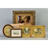 A FRAMED AND GLAZED CHRYSTOLEUM, family scene, with an oval embroidery of a girl picking apples, a