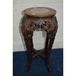 A CHINESE HARDWOOD CIRCULAR LOW STAND with a veined marble panel above a carved and pierced frieze