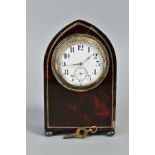 AN EDWARDIAN TORTOISESHELL AND SILVER MOUNTED DESK TIMEPIECE, of arched form, white enamel dial with