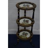A LATE 19TH CENTURY EBONISED AND GILTWOOD CIRCULAR THREE TIER STAND, each tier inset with a