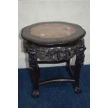 A CHINESE HARDWOOD CIRCULAR WAVY EDGED JARDINIERE STAND with a veined marble panel above a carved