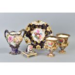 A PAIR OF EARLY 20TH CENTURY CROWN STAFFORDSHIRE PORCELAIN TWIN HANDLED URNS, painted with