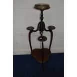 A LATE 19TH CENTURY MAHOGANY AND BRASS MOUNTED THREE TIER STAND, the top circular tier with a