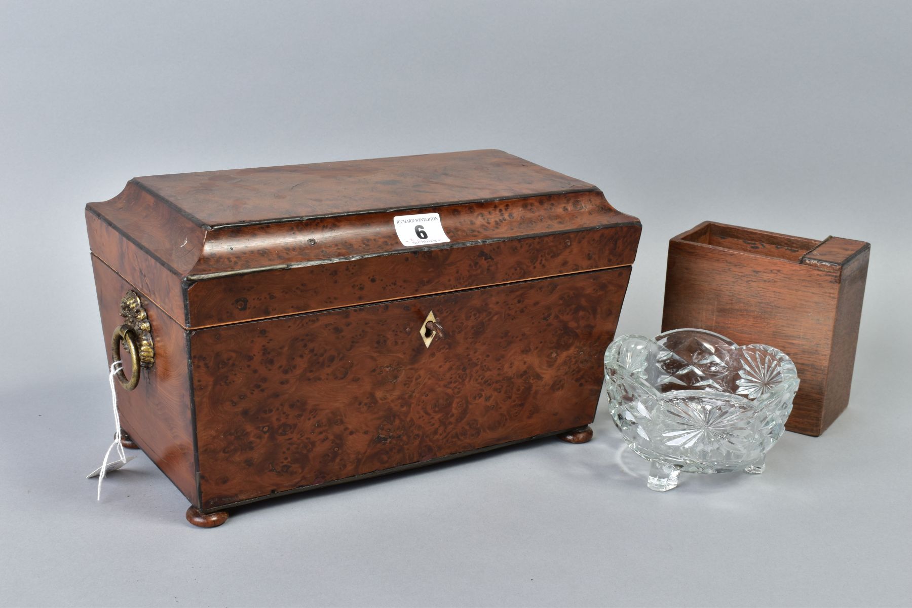 AN EARLY VICTORIAN AMBOYNA TEA CADDY, of sarcophagus form, gilt metal ring handles to sides, bun - Image 4 of 6