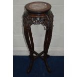 A TALL CHINESE HARDWOOD CIRCULAR JARDINIERE STAND, with a veined marble panel above a carved and