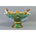 A 19TH CENTURY MAJOLICA TWIN HANDLED JARDINIERE OF SHAPED OVAL FORM, boy figure head and foliate