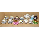 A COLLECTION OF ROYAL WORCESTER COFFEE CANS AND SAUCERS, MINIATURE ITEMS, ETC, including a three