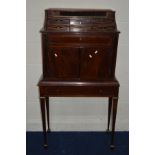 A REGENCY AND LATER MAHOGANY AND BRASS STRUNG CABINET ON STAND, the cascade top with a tambour