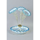 A LATE VICTORIAN BLUE, VASELINE AND CLEAR GLASS EPERGNE, three trumpets, frilled rims and with